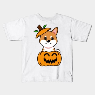 Funny orange dog is in a pumpkin Kids T-Shirt